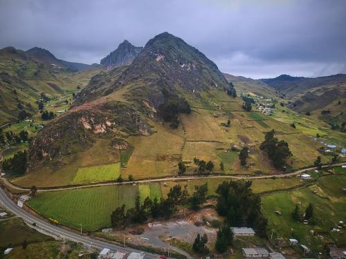 an aerial view of a mountain with a road at Hostal Kuyllur Ñan in Zumbahua