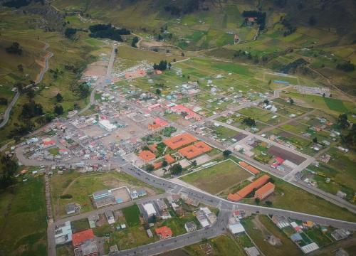 an aerial view of a city with buildings and roads at Hostal Kuyllur Ñan in Zumbahua