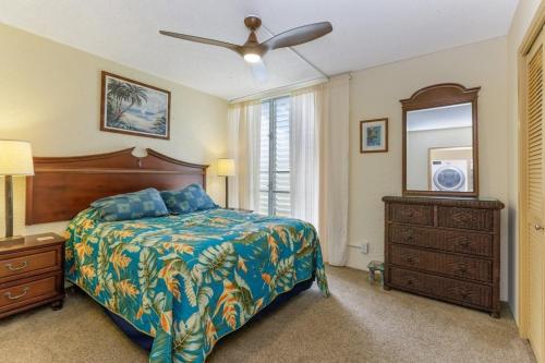Llit o llits en una habitació de Alii Villas Condominiums