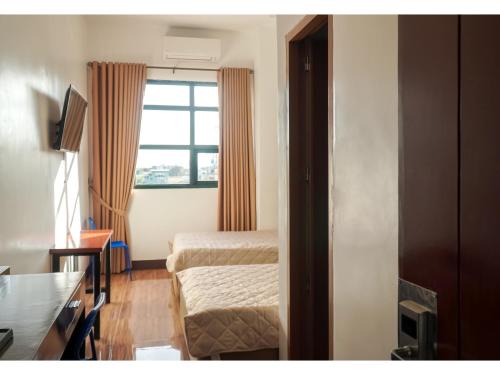 Postel nebo postele na pokoji v ubytování M28 Hotel and Apartments