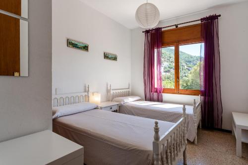 Postel nebo postele na pokoji v ubytování Un paraíso en la Costa Brava
