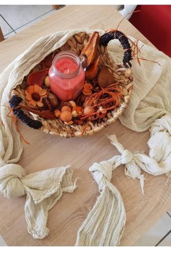 a basket of food with a jar on a table at DIMHA Studio in Pýrgos