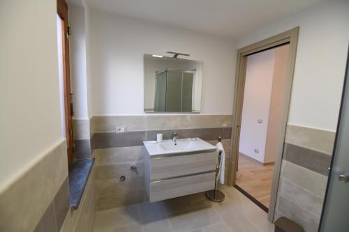 a bathroom with a sink and a mirror at Casa Vacanze Andromeda in Agerola