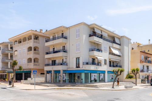 an apartment building on the corner of a street at Neo in Cala Ratjada