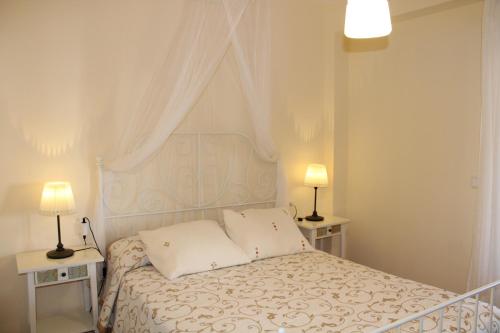 Ένα ή περισσότερα κρεβάτια σε δωμάτιο στο Marina Esuri. Bonito apartamento junto al Algarve portugués y 10 minutos de Isla Canela.