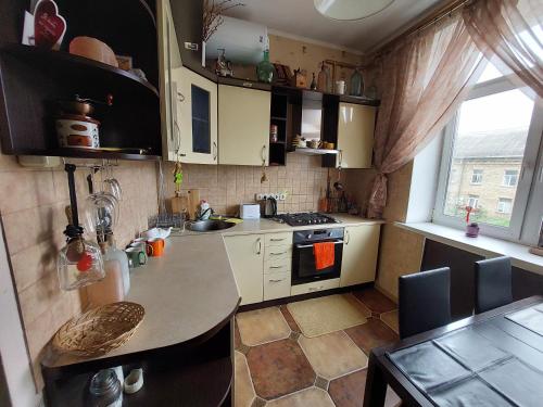 a kitchen with a sink and a counter top at Alabama in Kyiv