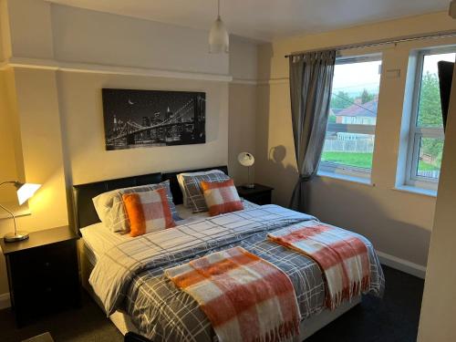 A bed or beds in a room at Upton Arms Hotel