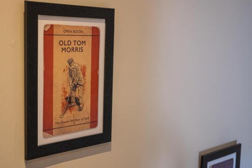 a picture of an old town morris poster on a wall at The Arran, St Andrews in St. Andrews