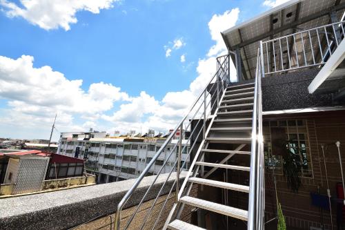 a ladder on the side of a building at Serenity Moutainview Homestay in Meinong