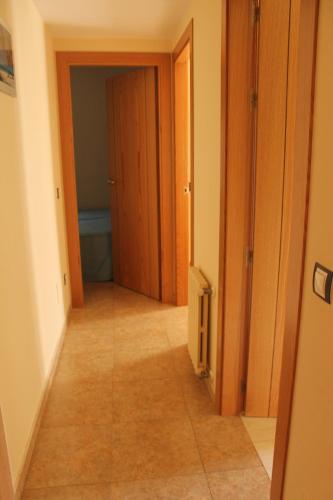 a hallway of a room with a door and a tile floor at Apartaments Vilaró in Llorts