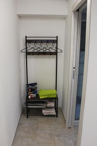 a walk in closet with a shelf in a room at B&B Sa Pedra Longa in Uri