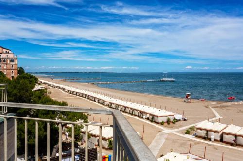 a view of the beach from a balcony at Hotel Petit Palais in Venice-Lido