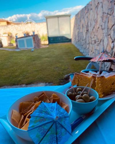 a blue table with a tray of food on it at B&B Il Sentiero in San Sperate