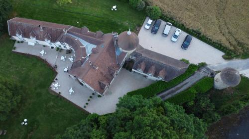 an overhead view of an old house with a yard at Le Petit Château in Baye