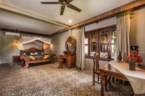Ένα ή περισσότερα κρεβάτια σε δωμάτιο στο Phum Khmer Lodge - Village Cambodian Eco-Lodge