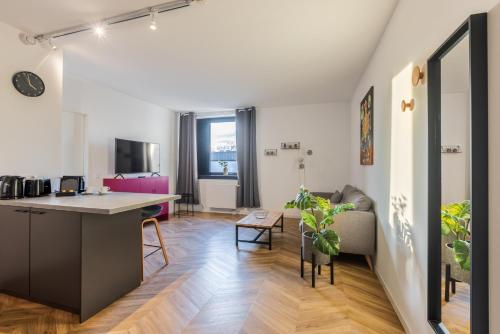 an apartment with a kitchen and a living room at Glück Auf Appartements Düppelstraße in Oberhausen