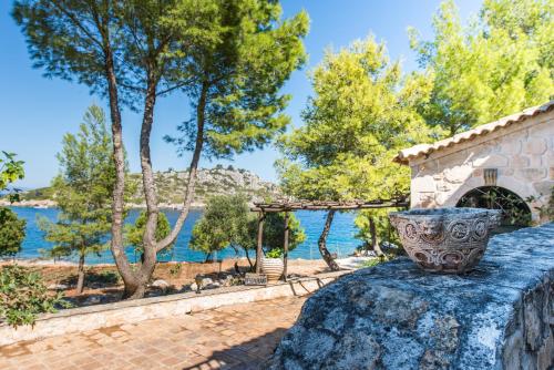 a villa with a view of the water at Nobelos Seaside Lodge in Agios Nikolaos