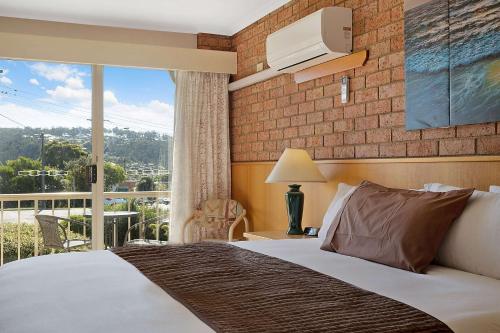Ένα ή περισσότερα κρεβάτια σε δωμάτιο στο Merimbula Sapphire Motel
