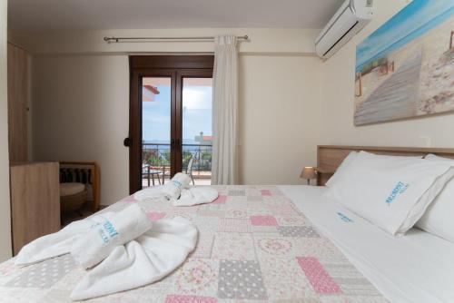 A bed or beds in a room at Ariadni -Villas- luxury houses