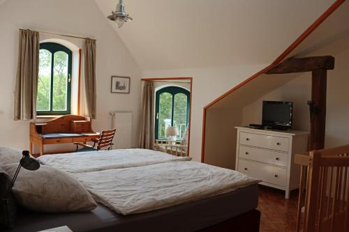 Säng eller sängar i ett rum på Gutshaus Alt Vorwerk