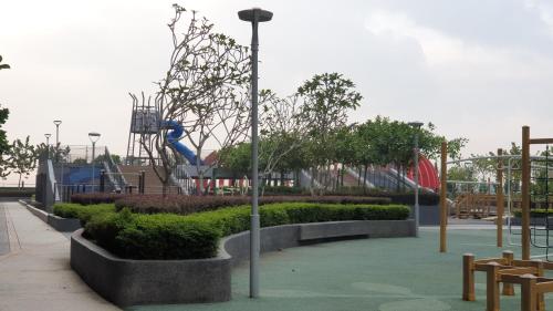 a park with a playground with a slide at BSP21 Family Homestay in Jenjarum