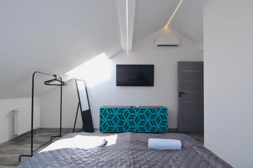 Ein Bett oder Betten in einem Zimmer der Unterkunft Apartamenty Żołnierska 31 - Apartament nr 1