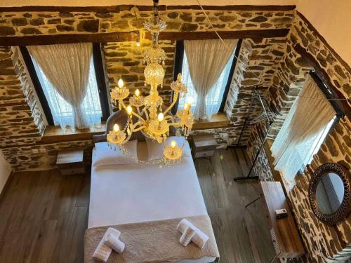 an overhead view of a living room with a chandelier at Theokleia_guest house in Kavala