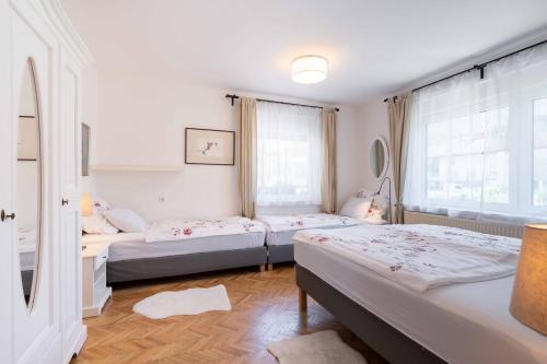 Postel nebo postele na pokoji v ubytování Apartma Peček Kranjska Gora