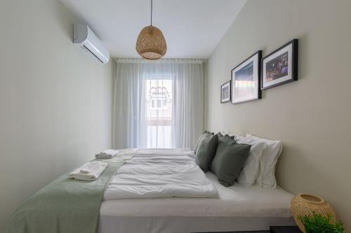 Posteľ alebo postele v izbe v ubytovaní Second Home Apartment