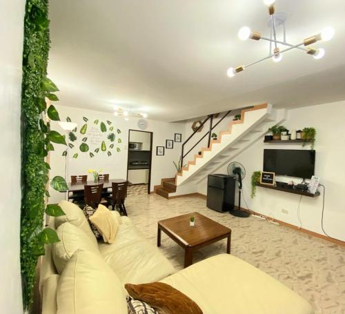 Seating area sa RUSTIC THEMED - 2BR TownHouse - near Clark Airport - TRP4