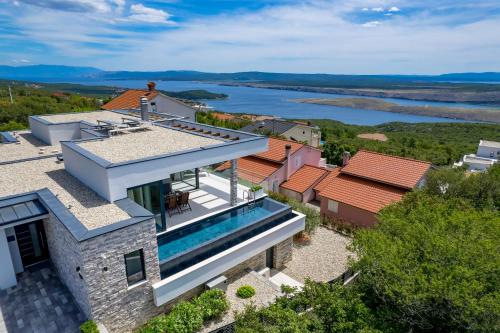 an aerial view of a house with a swimming pool at House7E in Šmrika