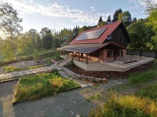 an overhead view of a house with a red roof at Chata nad Dziką Orlicą z jacuzzi in Poniatów