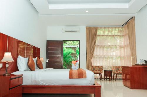 Tempat tidur dalam kamar di Argya Santi Suite and Villas