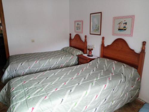 Łóżko lub łóżka w pokoju w obiekcie Piso de 4 habitaciones