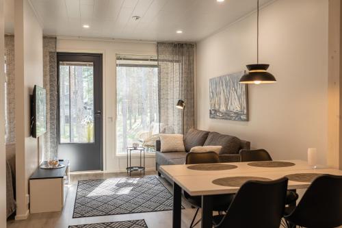 Posezení v ubytování Tuomenkartano Apartments by Hiekka Booking