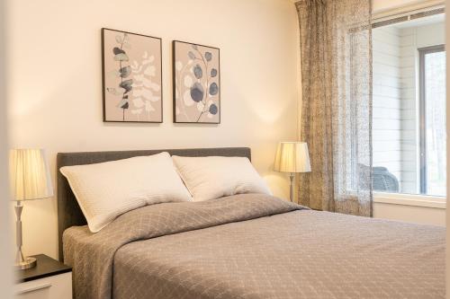 Postel nebo postele na pokoji v ubytování Tuomenkartano Apartments by Hiekka Booking