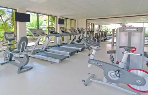 a row of cardio machines in a gym at Radisson Grenada Beach Resort in Grand Anse