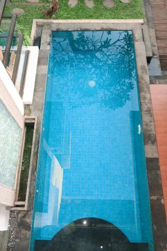 an overhead view of a large blue swimming pool at Argya Santi Suite and Villas in Seminyak