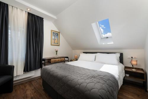 a hotel room with a bed and a window at Angelo Spa Resort in Sankt Andreasberg