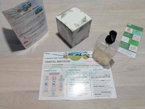 a table with a box and a bottle of soap at Rivière & Cottage 4 étoiles en Auvergne - Cantal Auvergne - Valette & Riom in Valette