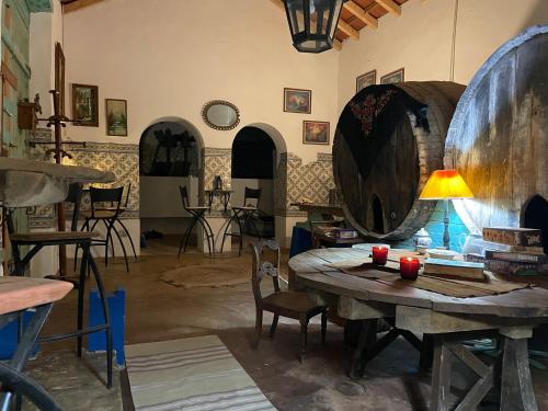 a room with a table and a large barrel at Casal de Santanna in Cartaxo