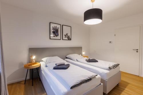 Giường trong phòng chung tại Glück Auf Appartements Walter-Hohmann-Straße Essen