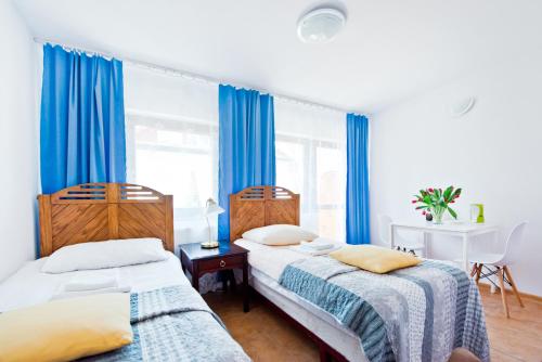 Postel nebo postele na pokoji v ubytování Ośrodek Wypoczynkowy Jantar