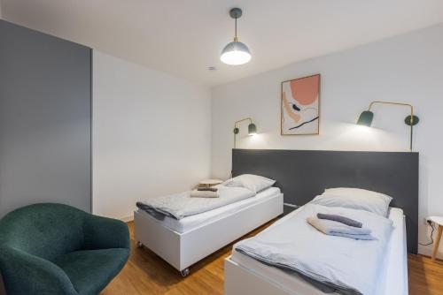 Postel nebo postele na pokoji v ubytování Glück Auf Appartements Lösorter Straße Duisburg