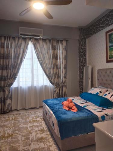 a bedroom with two beds and a window at Cmk APARTMEN KOTA SRI MUTIARA# Free Netflix in Kota Bharu