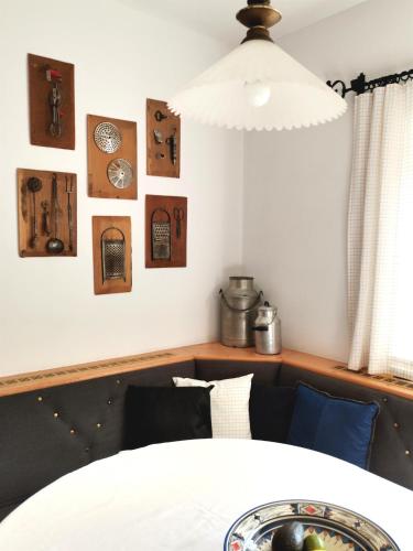a dining room with a table and some pictures on the wall at Bodenschmiede in Hopfgarten im Brixental
