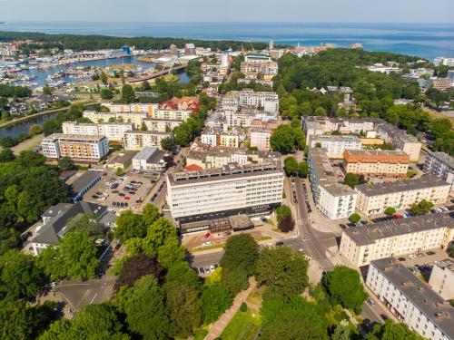 an aerial view of a city with buildings at Hotel New Skanpol in Kołobrzeg