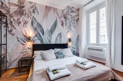 A bed or beds in a room at BBL - Trevi 2Bdr Apartment