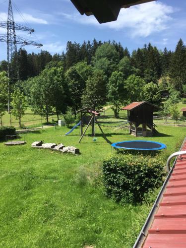 a park with a playground and a swing set at Gut Tausendbachl in Regen