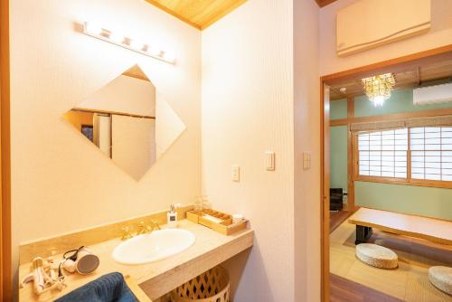 a bathroom with a sink and a mirror at Japanese traditional house.Ryokan in asakusa with 2bedrooms in Tokyo
